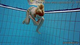 Petite teen Milana Voda braves naked underwater swim session