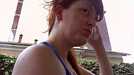 Nicoletta in her rich garden trying earrings, feeling so excited for ear lovers