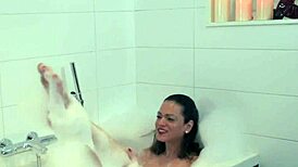 Solo bathing shemale tugs hard in tub 🛁