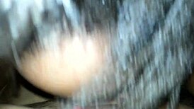 Ebony wife sucks husband's cock in intimate bedroom scene.