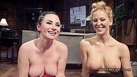 Blonde mistress fingers brunette's ass in submission