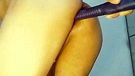 gay guy explores anal with dildo in intimate scene