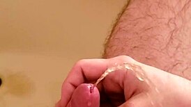 Watch this old man PISS on the shaved hairless cock with his SMALL DICK!