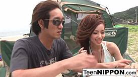 Japanese girlfriend enjoys a quiet outdoor moment with her guy