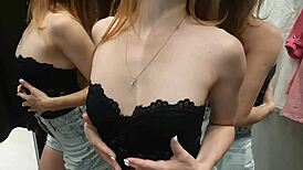 fitting room excited couple enjoys intimate moment without shyness