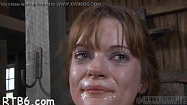 in this rope bondage video, she's bound and spanked, sucking cock hard