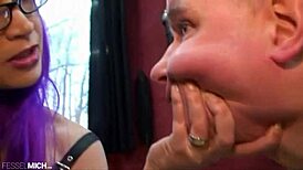 mistress spanks slave in leggings on st. andrew's cross