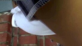 The asian babe gives a naked blowjob to the cock.