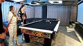 Two fiery latinas engage in threesome with big cocks on pool table, sucking and fucking