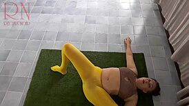 Regina Noir Stuns in Yellow Tights During Yoga Session at Gym