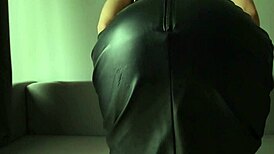 Teen slowly strips off leather skirt