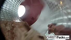 Steamy shower turned wild with Christy, Dahlia, and Ivan enjoying hot lesbian play. Their tattooed bodies glistened under water.