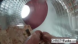 Steamy shower turned wild with Christy, Dahlia, and Ivan enjoying hot lesbian play. Their tattooed bodies glistened under water.