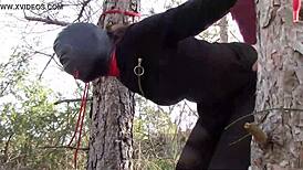 Yo, tied her up outdoors in pantyhose and boots for a rough bang! 😈