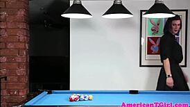 Hey, check out this tattooed pierced tgirl stroking herself hard on a pooltable. What a sight!