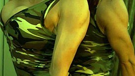 busty ginger shows off muscles in mirror