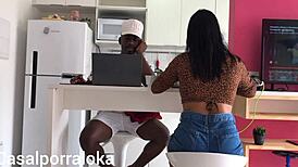 Naughty wife teases husband in kitchen while friend chats