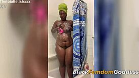 ebony goddess claps booty and plays with toys in shower