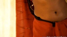 She's teasing and dancing nude, stripping sensually