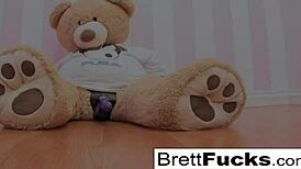 Busty Brett Rossi plays with a stuffed bears strap-on dildo!