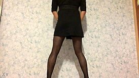 Shemale performs an enticing dance in stockings