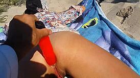 dildo banging with creamy finish on nudist beach
