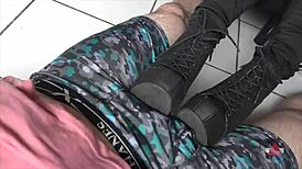 Milf rests boots on my cock and balls teasing intensely