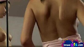 hot brunette showing natural tits and masturbating with dildo