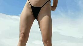 Kiara Meow teases with wet, naked body on a sexy beach workout