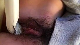 Wow, check this Japanese girl rubbing her hairy pussy up close 'til she squirts!