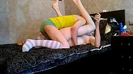 cute boys playing on a bed