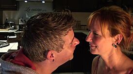 Cute loving couple shares intimate moments in the kitchen