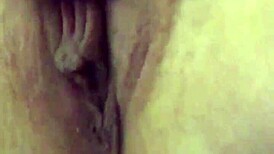 Using vibrator on her dry pussy lips, teasing those sexy folds with intense toy play.