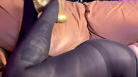 She masturbates in black pantyhose, reaching orgasm while wearing heels and leggings.