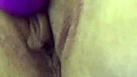 Using vibrator on her dry pussy lips, teasing those sexy folds with intense toy play.