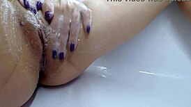 golden rain close-up with intense muff diving on a shaved hairless pussy.