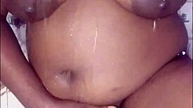 Hey, watch this thick ebony babe fuck and dance in the shower! 💃🛁