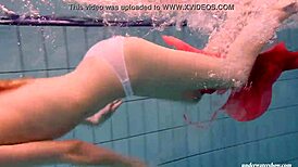 Feeling the thrill of firm tits in red dress underwater