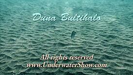 Feeling the thrill of firm tits in red dress underwater