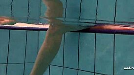 Feeling the thrill of firm tits in red dress underwater