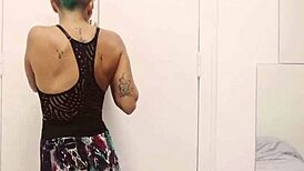 omg, short tattooed girl with green hair doin a hot striptease...
