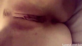 Sunny Lane Teases and Rubs Shaved Pussy Solo