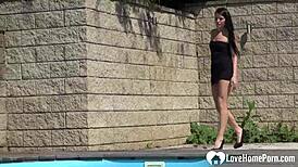 Brunette fingers her body outdoors