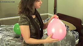 blowing balloons popping them while chewing bubblegum