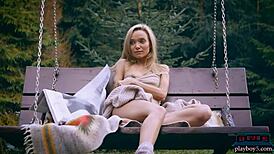Amazing Russian blonde Zhenya Belaya strips naked outdoors in wild forest