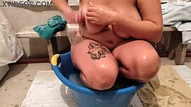 The village girl says, 'I'm washing my body in this basin of water.'