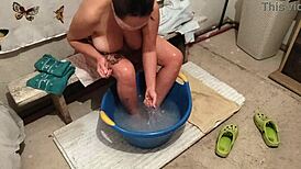 The village girl says, 'I'm washing my body in this basin of water.'