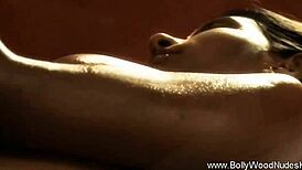 A brunette Asian milf seduces her friend with Bollywood-inspired moves.