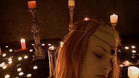 Suggestive cosplay ritual with candlelight masturbation on natural tits