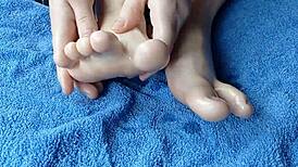 Close-up of oiled feet in homemade video